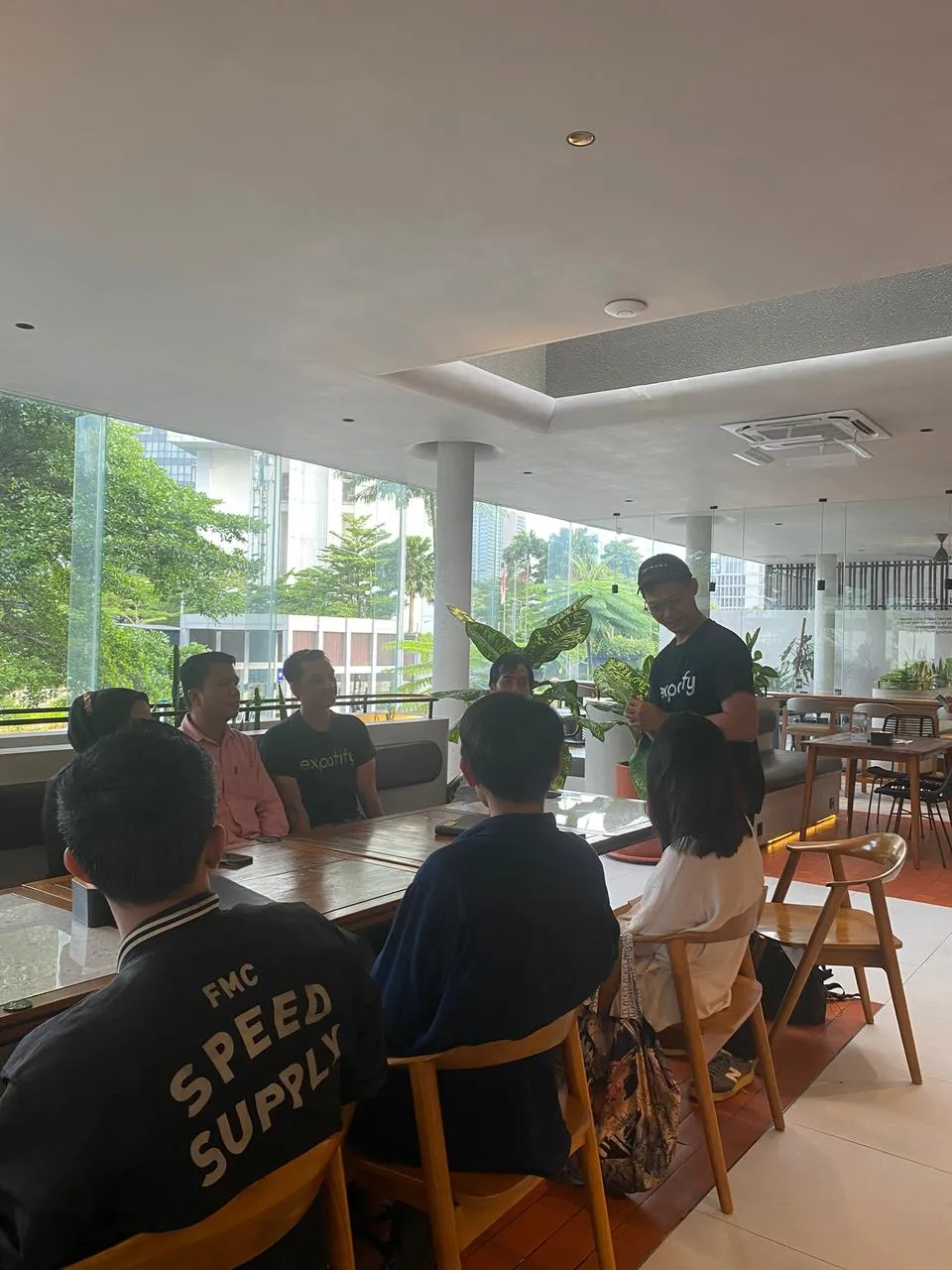 Roundtable group conversation at Executive Iftar 2026, Expatify host introducing the discussion