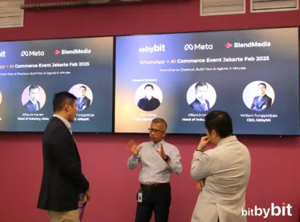 Three speakers in discussion on stage at the WhatsApp + AI Commerce Event Jakarta, February 2025