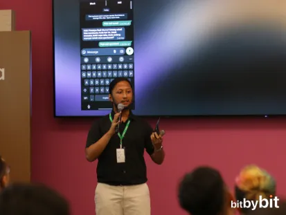 Presenter on stage with a WhatsApp chat preview behind, at the AI for WhatsApp Marketing event in Jakarta